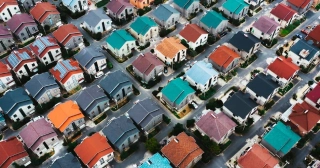 Aerial view of colorful rooftops in a neighborhood. 