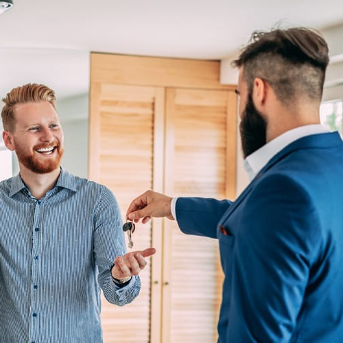 Buying a house for sale by the owner, symbolizing a direct purchase from a homeowner.