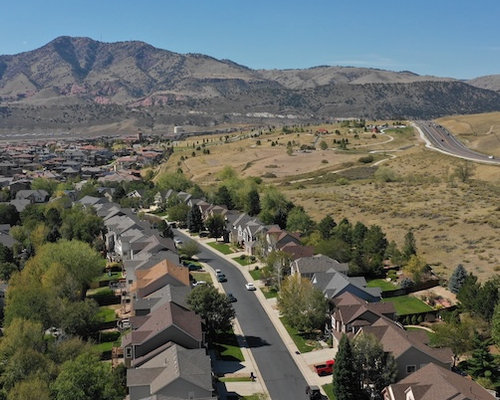 Aerial view of homes in Colorado mountains.