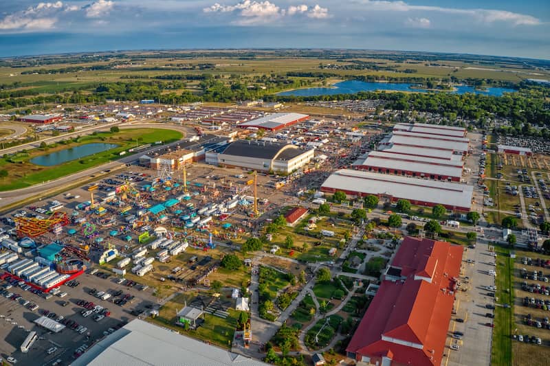 RHB Assets From IGX: Aerial view of the State Fair in Grand Island, Nebraska, with colorful rides and attractions.