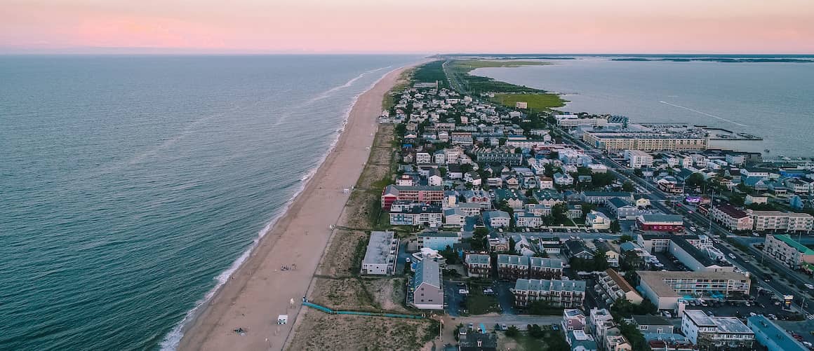 RHB Assets From IGX: Aerial view of a Delaware beach with sand and waves