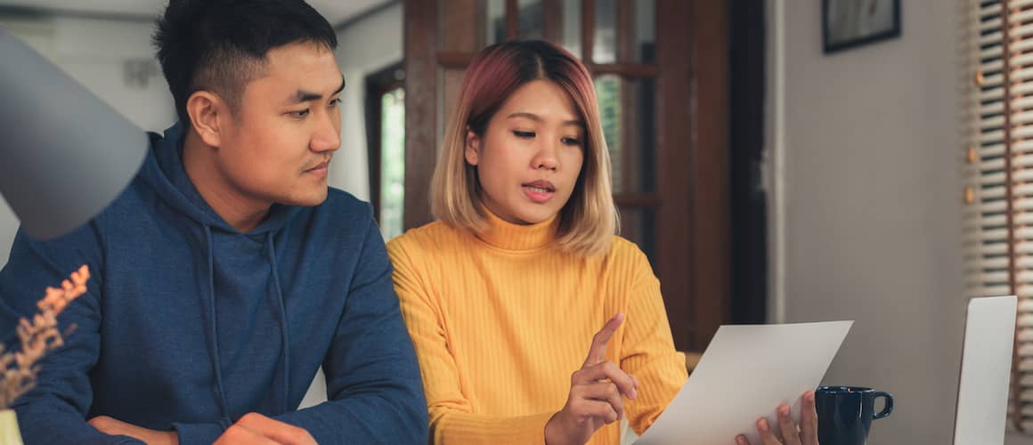 Stock-YoungCoupleFiguringOutSavingsAccounts-AdobeStock-235517650-copy.jpeg