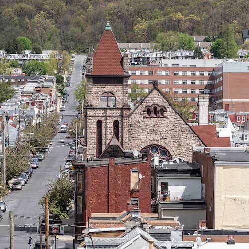 A street lined with cars and buildings in Reading, Pennsylvania.