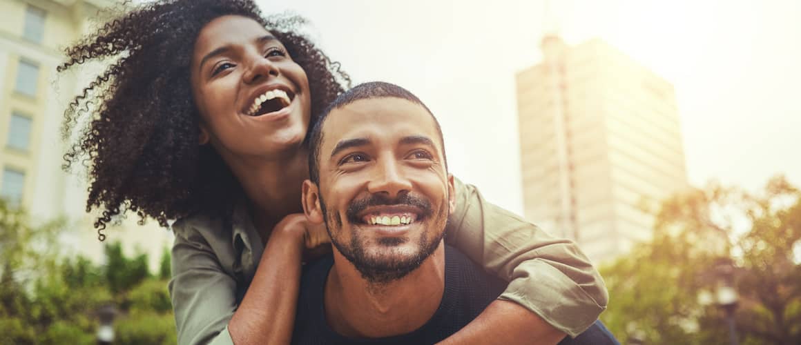 Smiling young couple having fun in a big city.