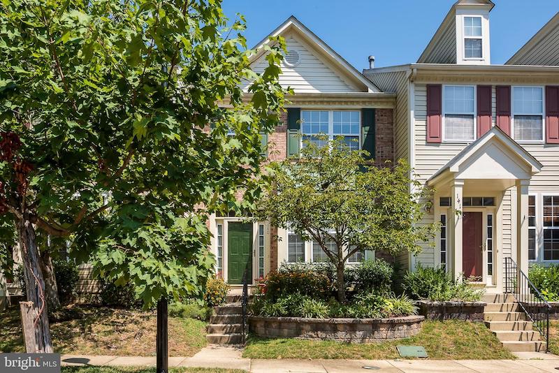 RHB Assets From IGX: Charming Annapolis house with brick exterior and white trim.