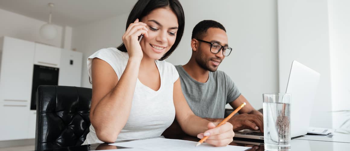 RHB Assets From IGX: Couple working together at a desk with a laptop