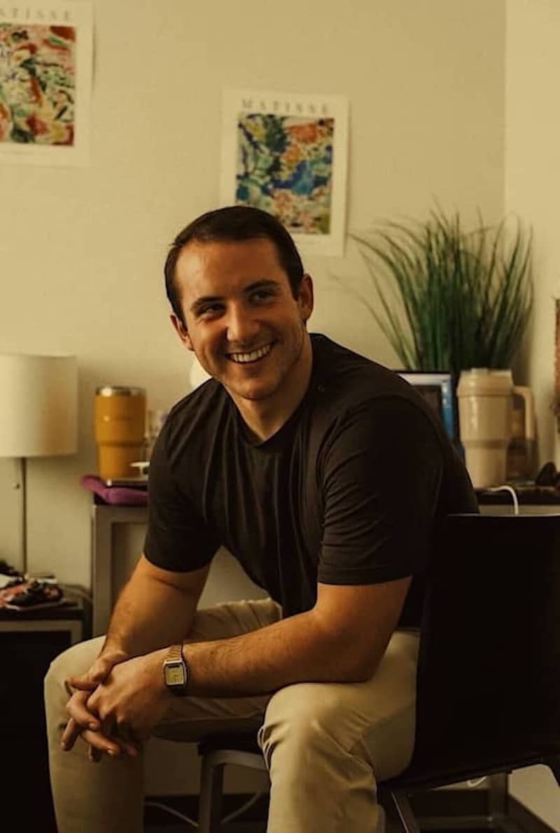 Team member sitting in a chair.