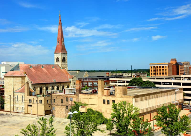 Aerial view of an Will, Illinois featuring historic church steeple.