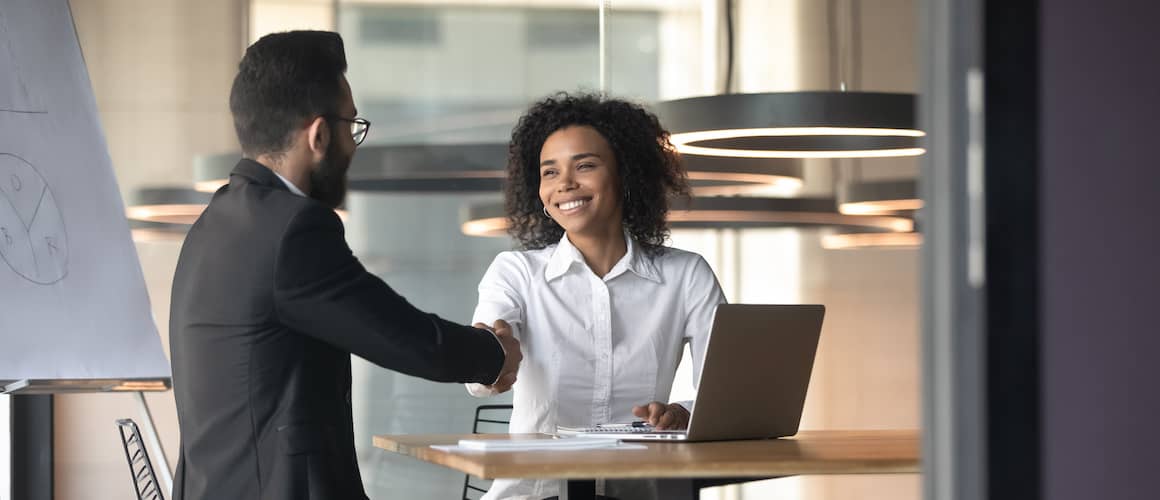 black business people shaking hands