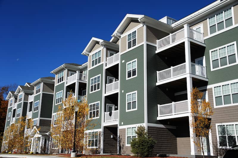 Exterior view of four story condominium building.