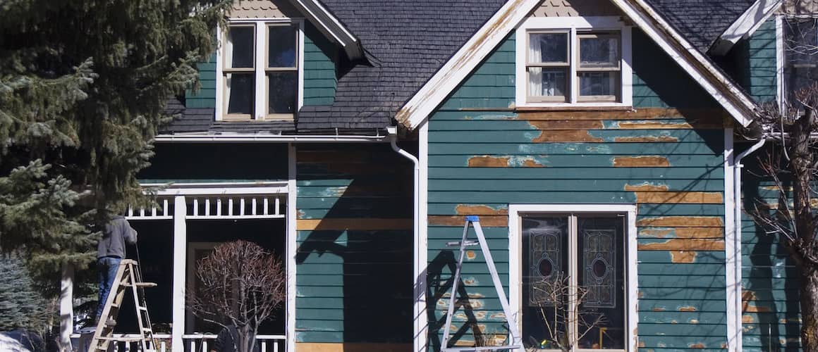 A house with peeling paint, suggesting a property in need of maintenance or renovation.