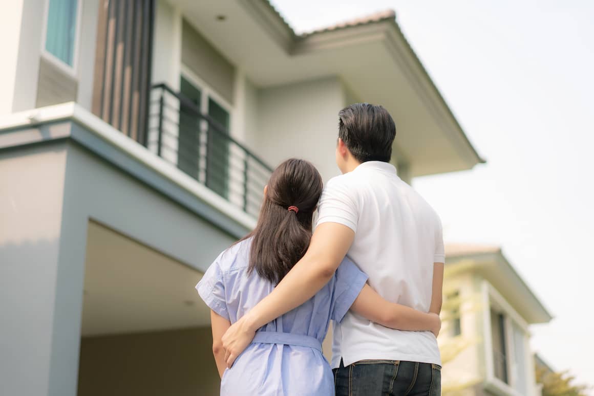 RHB Assets From IGX: Worried couple looking at a document about buying a house with bad credit