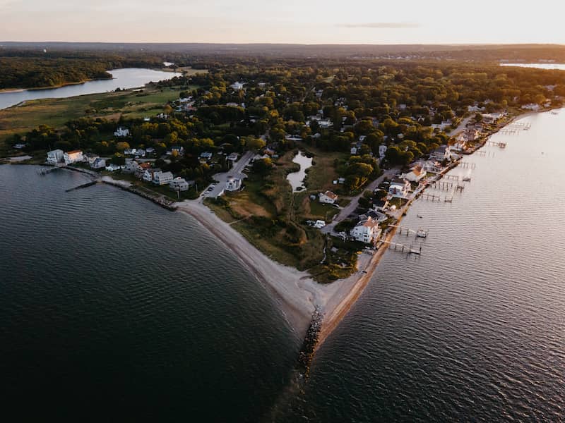 RHB Assets From IGX: Aerial landscape photograph of Warwick, Rhode Island, surrounded by ocean.