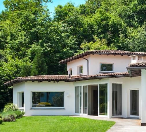 A white house exterior, illustrating a residential property with a classic design.