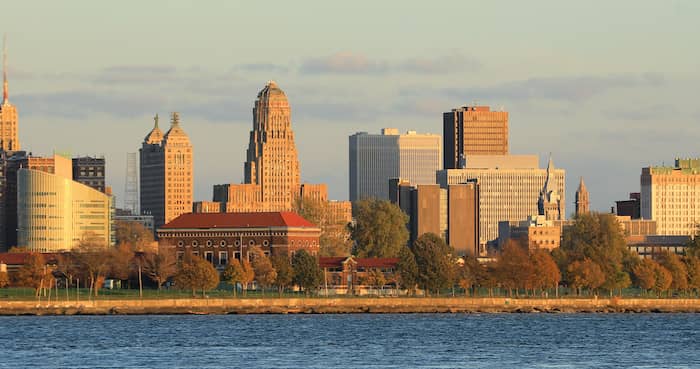 RHB Assets From IGX: Buffalo, New York skyline across the Niagara River at sunset.