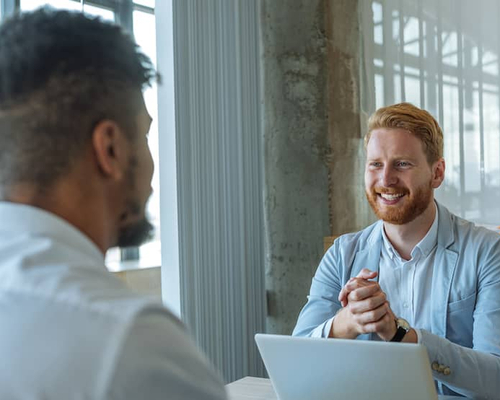 Two people in a casual business meeting.