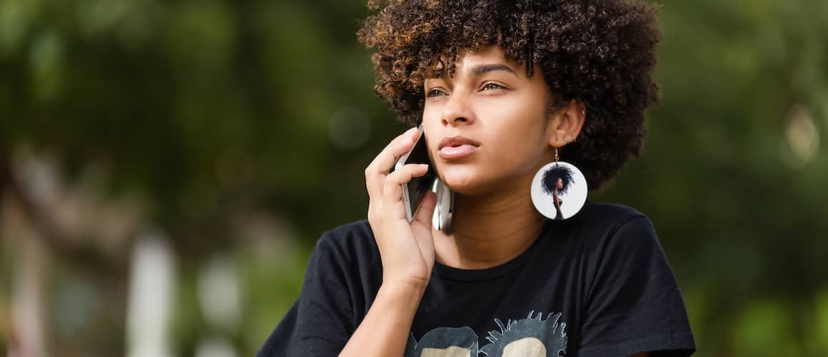 Young woman on mobile phone asking for personal loan.