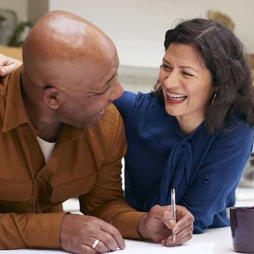 A man and women doing financing or taxes.