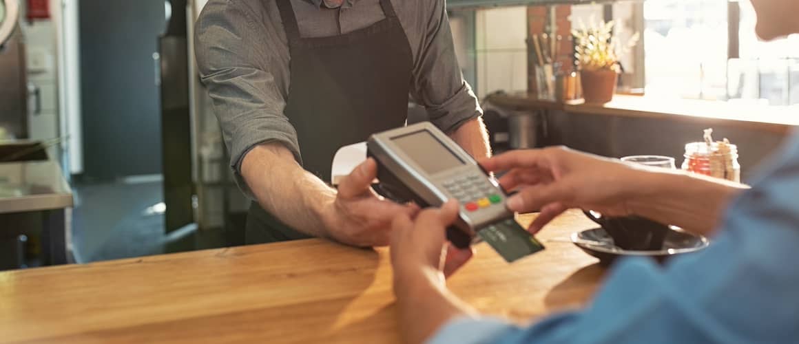 Waiter accepting payment by card