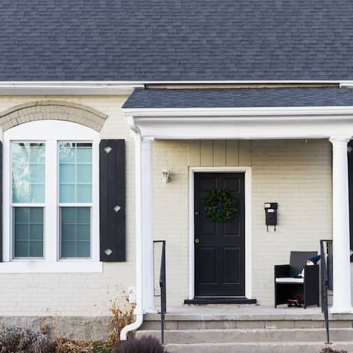 A white brick house, illustrating residential architecture and exterior design.