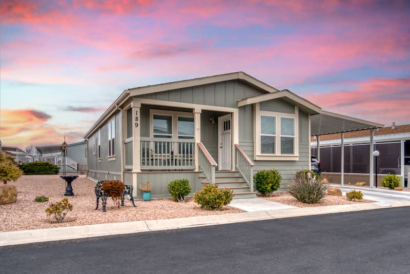 Front of a manufactured home at sunset.