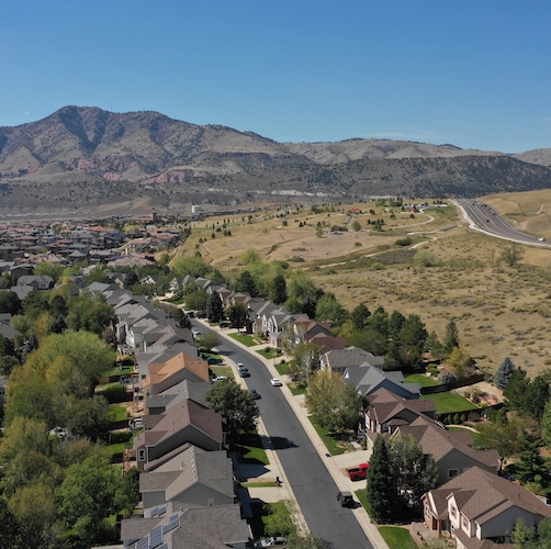 Aerial view of homes in Colorado mountains.