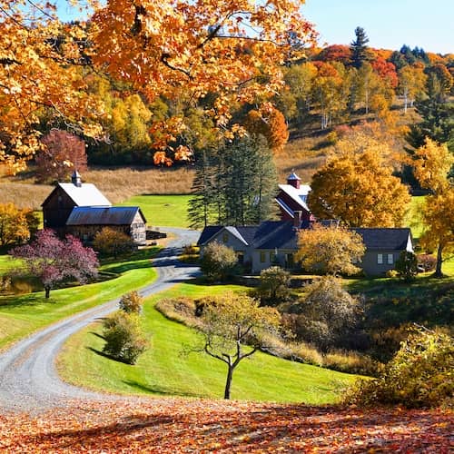 A beautiful home in the countryside surrounded by vibrant fall colors.