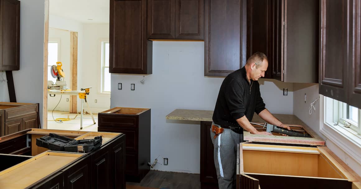 Man doing home project in kitchen.