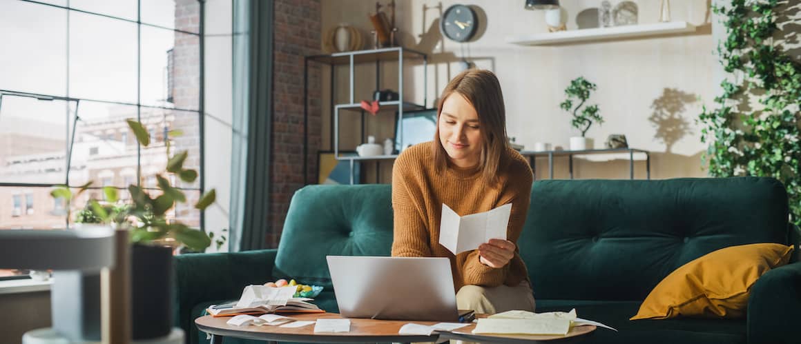 Woman checking savings account on computer.