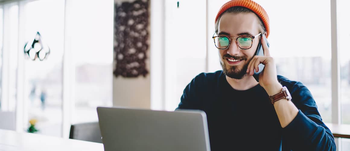 Man on phone getting mortgage pre-approval.