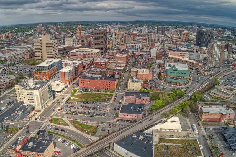 RHB Assets From IGX: Aerial view of Syracuse, New York with cityscape and river