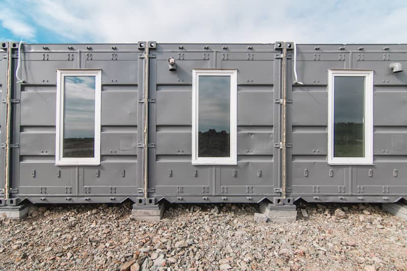 RHB Assets From IGX: A side-by-side shipping container home with a modern and industrial design.