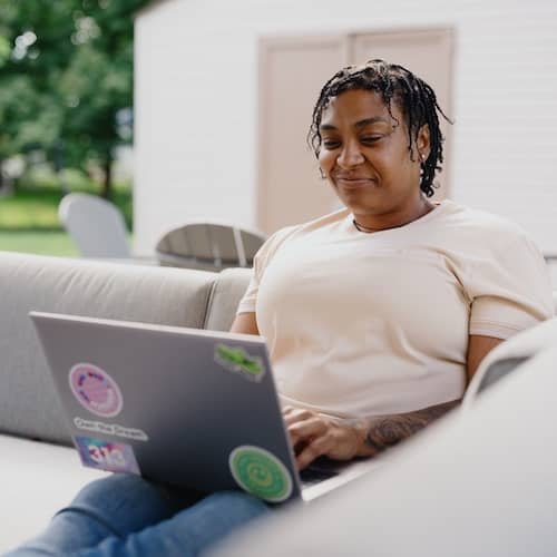 Team member working on a laptop.