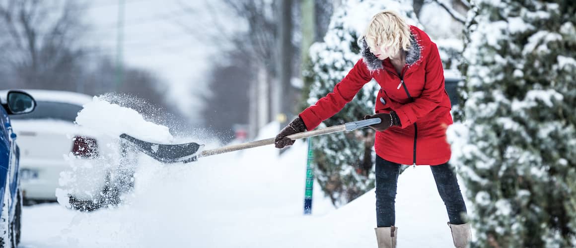 RHB Assets From IGX: A person shoveling snow from a driveway.