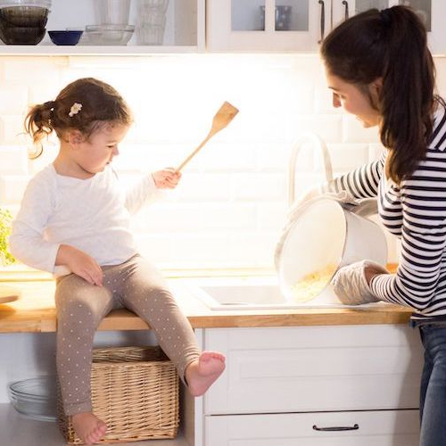 Mother and daughter cooking