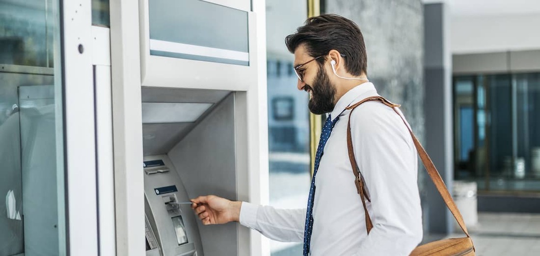 Stock-Man-At-ATM-AdobeStock-230069067 copy.jpeg