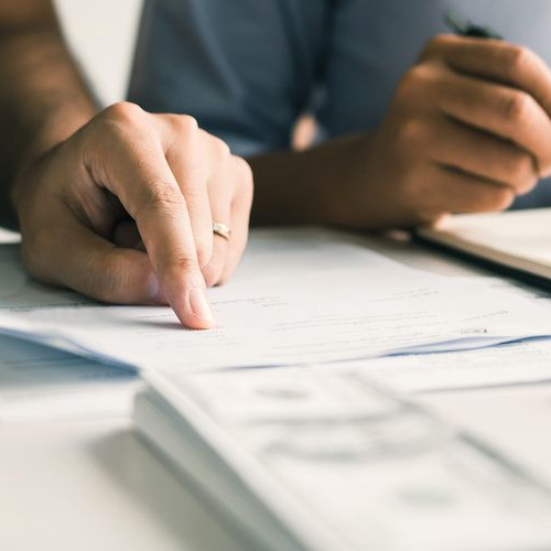 Two people discussing finances or some sort of payments.