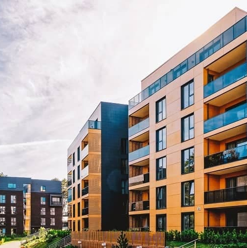 Condo building against a beautiful sky, showcasing a condominium structure against a scenic sky backdrop.