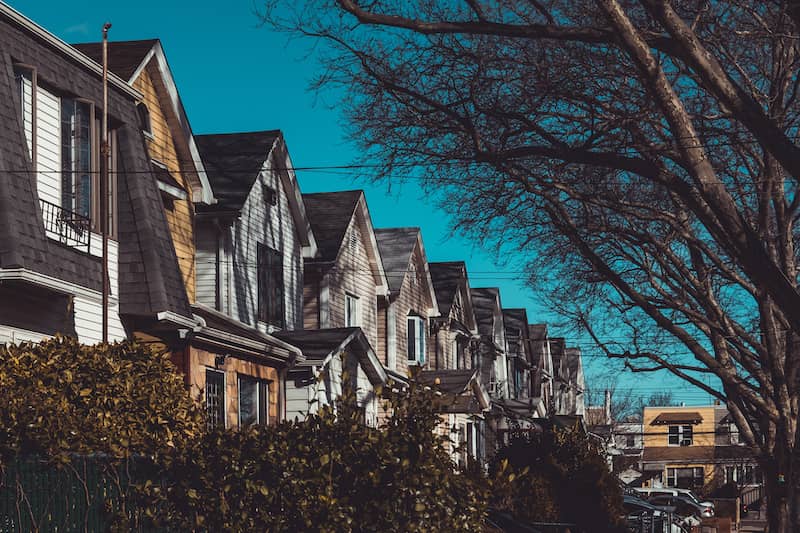 Row of two story homes in Queens, New York neighborhood.