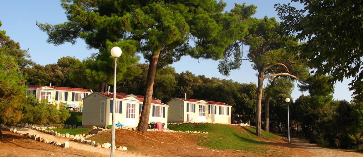 Stock image depicting mobile homes placed on a hill.
