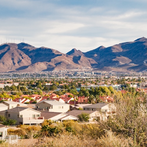 Aerial view of Henderson, Nevada, with mountains in the background,.