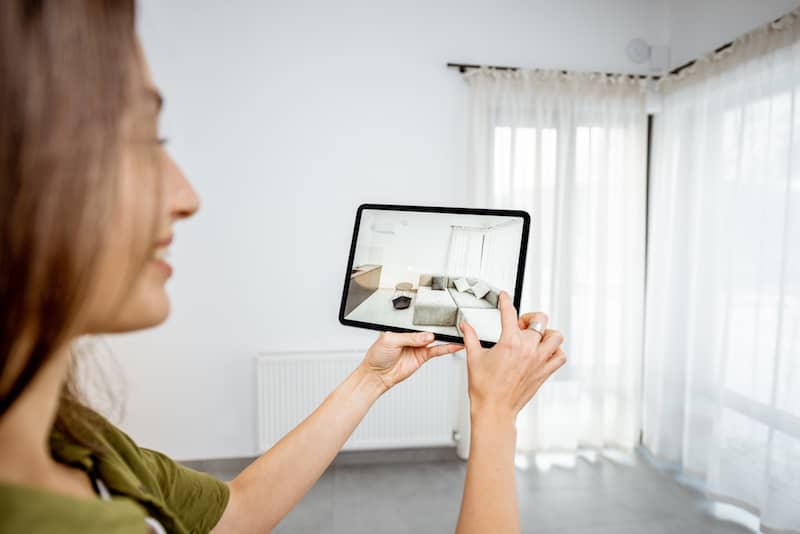 RHB Assets From IGX: Woman viewing photos on a tablet