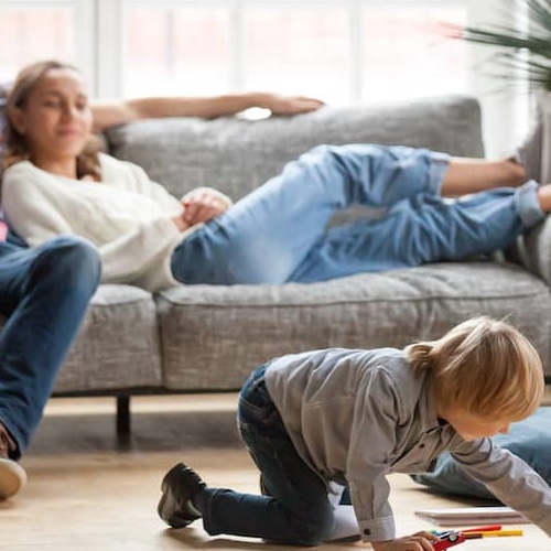 A family hanging out in the living room together.