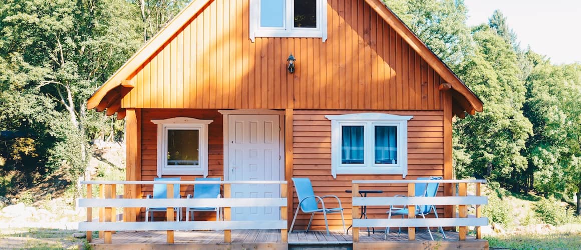 Small Norwegian-style cabin with front porch.