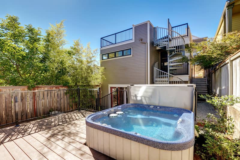 RHB Assets From IGX: Stylish backyard pool and hot tub combination with landscaping.