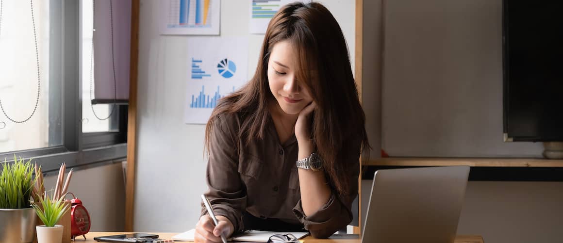 Asian Woman Doing Paperwork