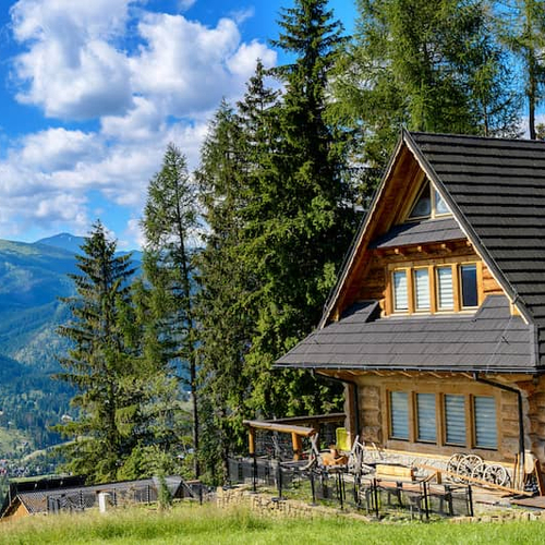 RHB Assets From IGX: Old stone cottage in mountain landscape