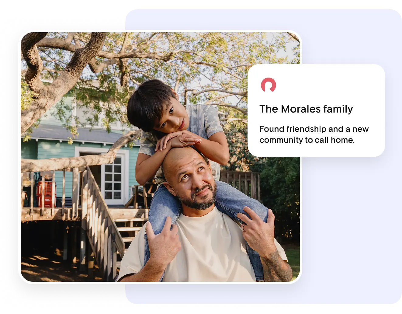 A child sits on someone’s shoulders in a backyard with trees. 