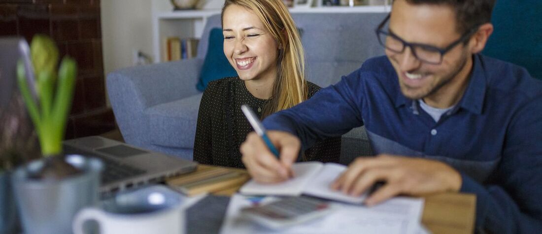 Stock-Couple-Budgeting-At-Coffee-Table-iStock-939301024-small-compressor.jpg