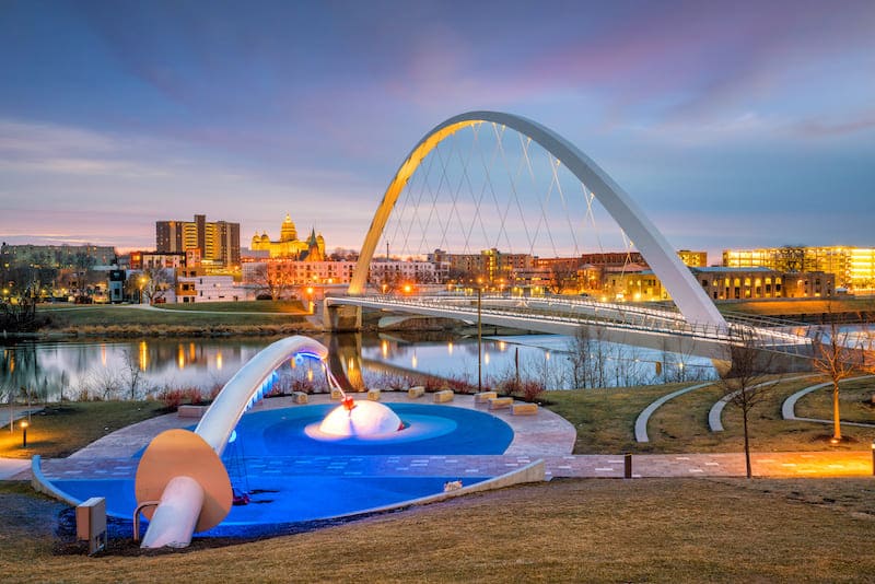 RHB Assets From IGX: A picturesque view of the Des Moines, Iowa skyline reflecting on a calm river.